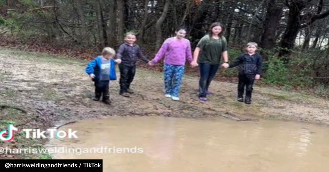 Playful Deer Goes Puddle Jumping With The Family That Feeds Him