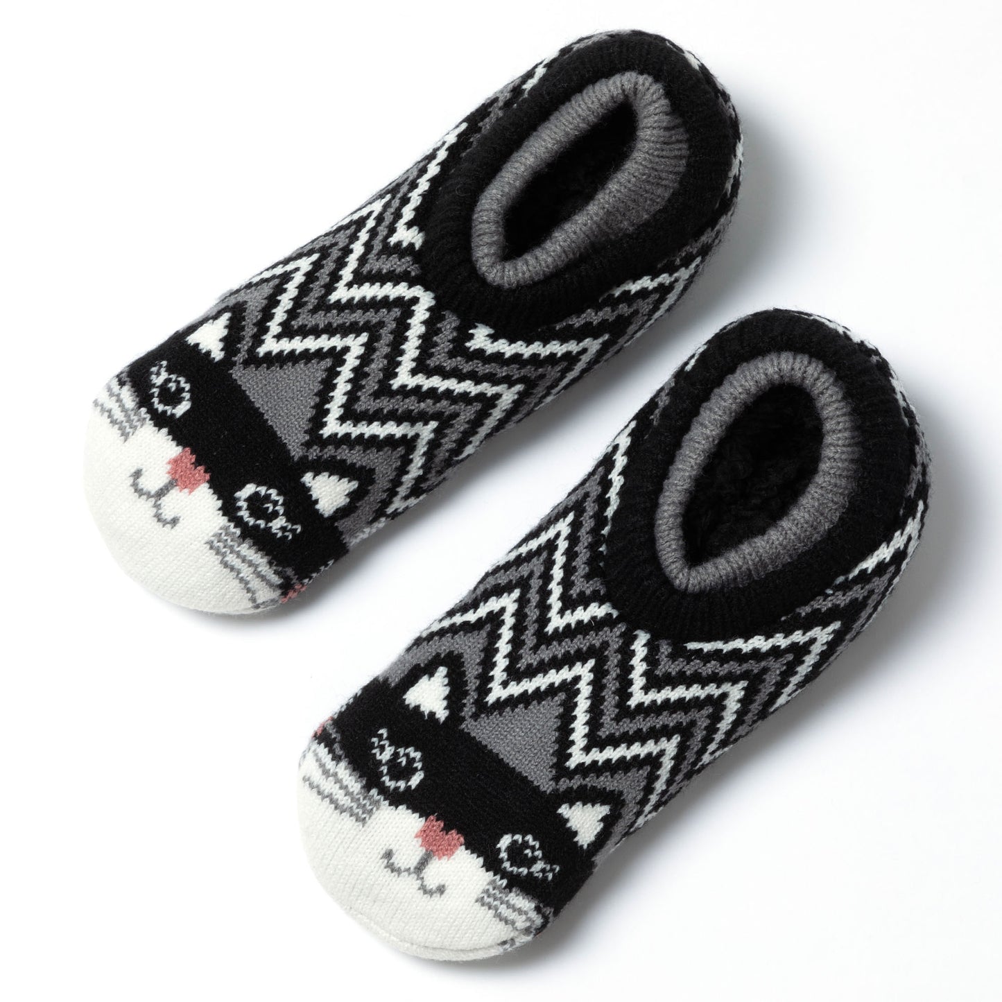 Knitted slipper socks with cat faces on the top. zig zag cat with a plush interior