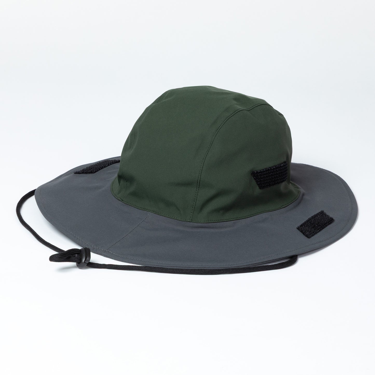 Two-toned hat with green top and gray brim on a white background