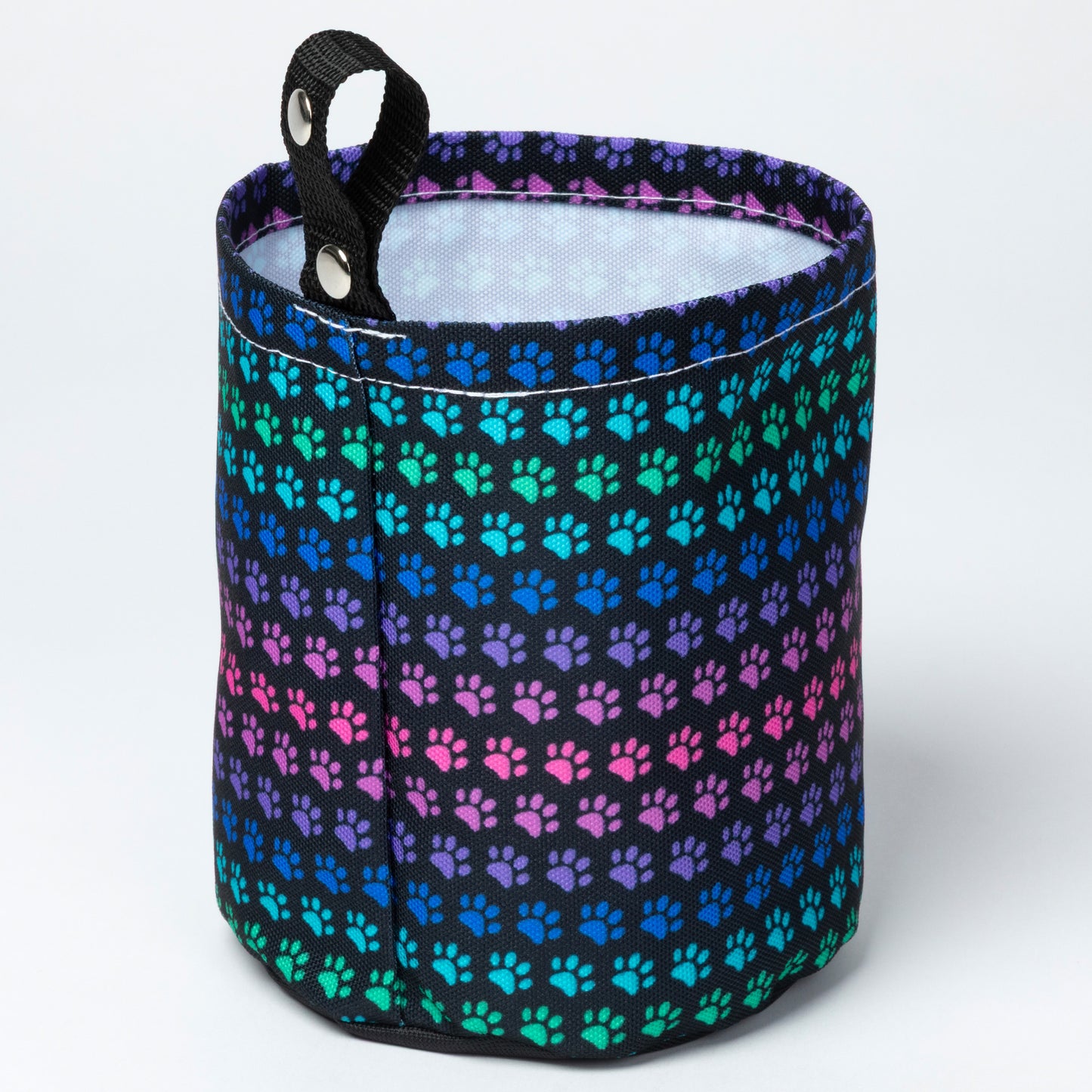 Car garbage holder cover with rainbow paw pattern.
