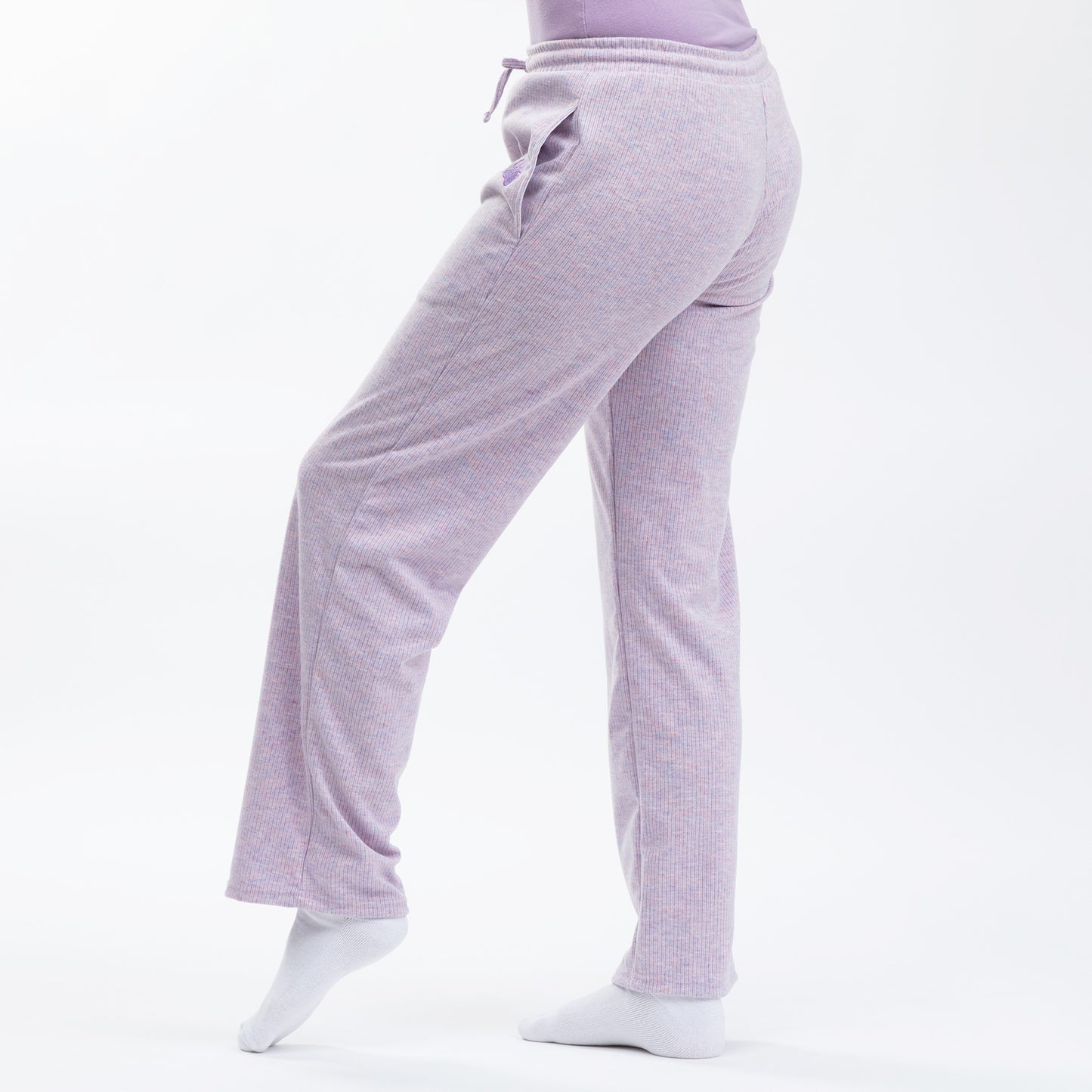 Light purple lounge pants worn by a person on a white background.