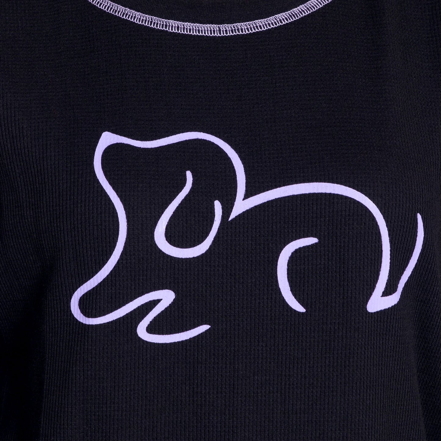 Black fabric featuring a minimalist purple line drawing of a playful dog.