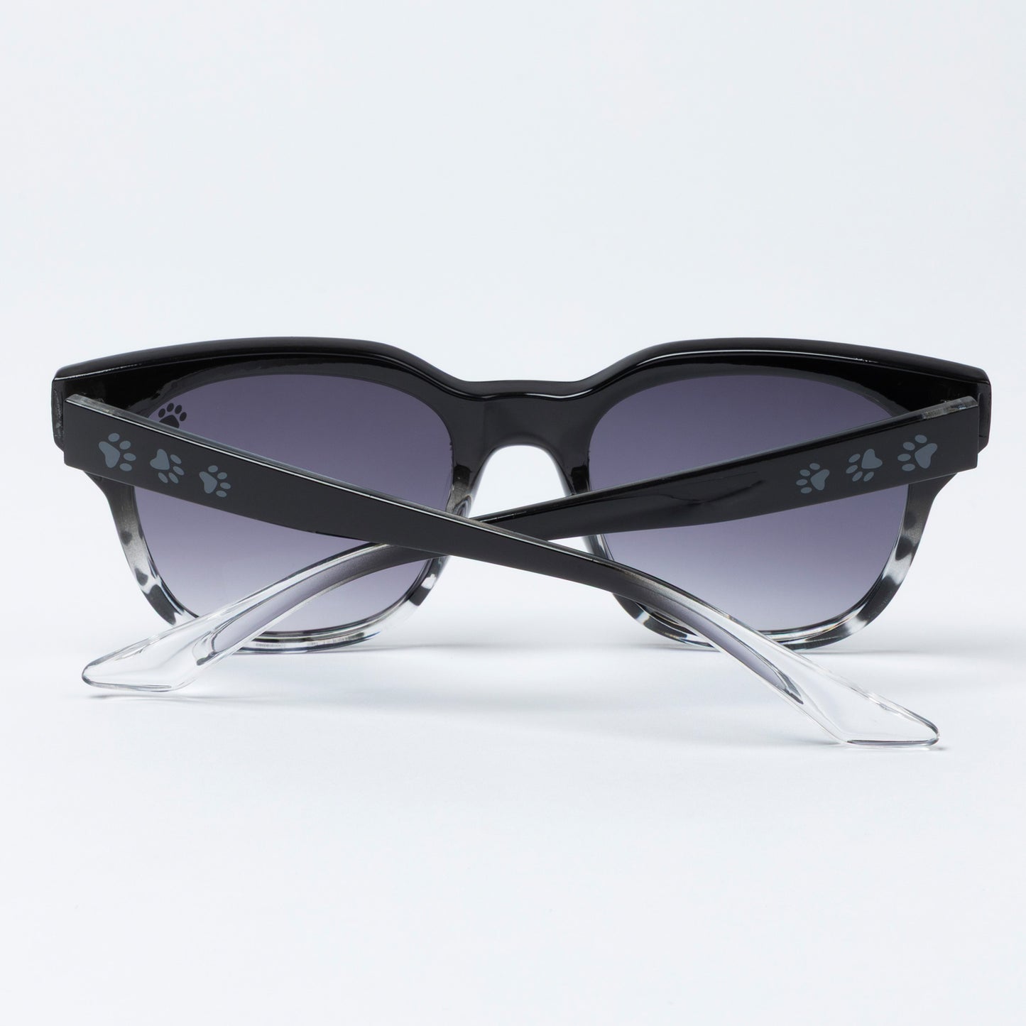 Black cat-eye sunglasses with paw print details on a white background