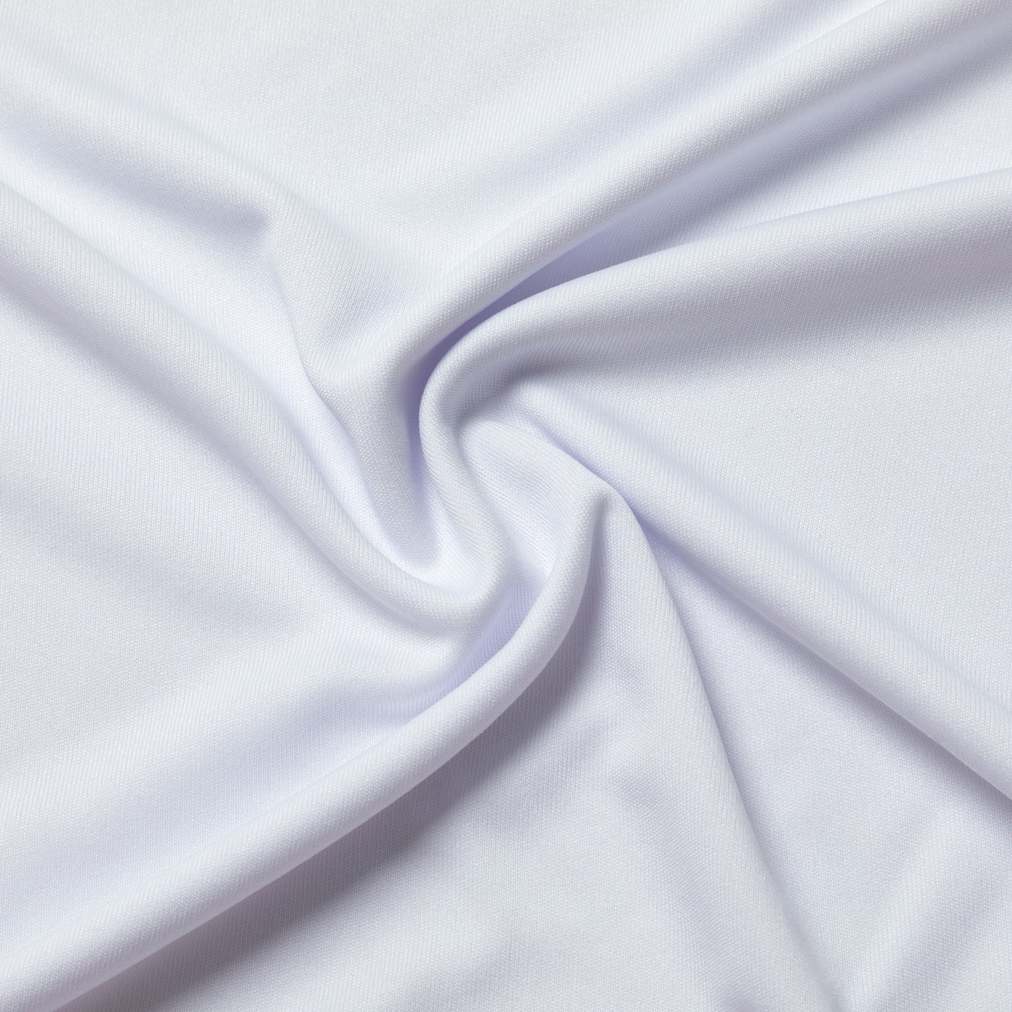 A close-up of draped white fabric with soft folds and a smooth texture filling the frame.