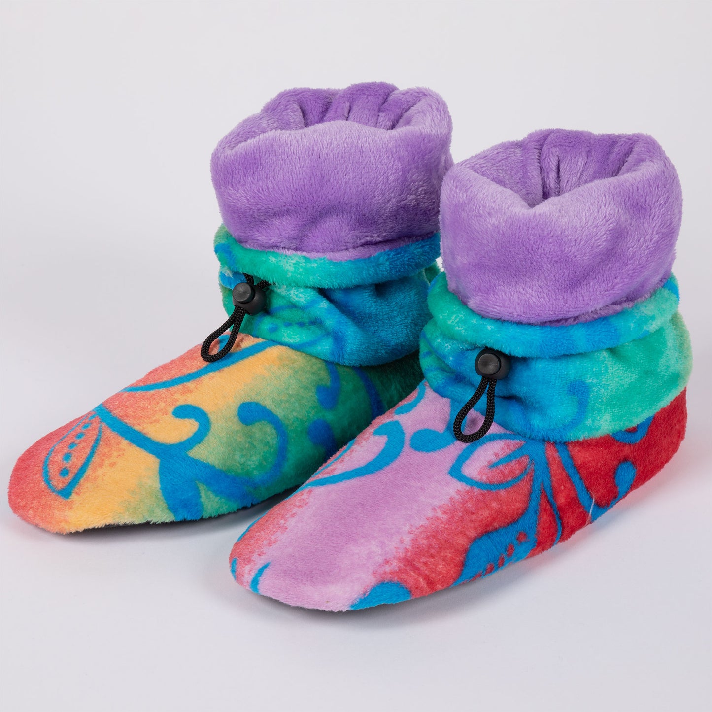 Rainbow color fleece slipper booties with blue swirls and paw prints, on a white background