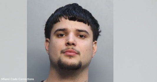 Mugshot of a young man against a plain gray background.