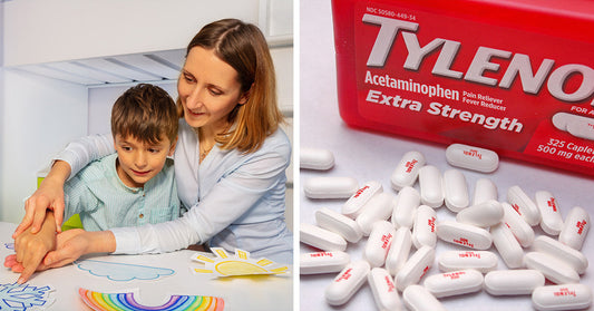 Young boy wearing headphones concentrates while drawing at a classroom desk, with a bottle of acetaminophen tablets beside him.