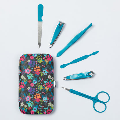 A set of manicure and pedicure tools arranged on a light gray background, including a floral-patterned case, turquoise nail clippers, a nail file, cuticle tools, and scissors.