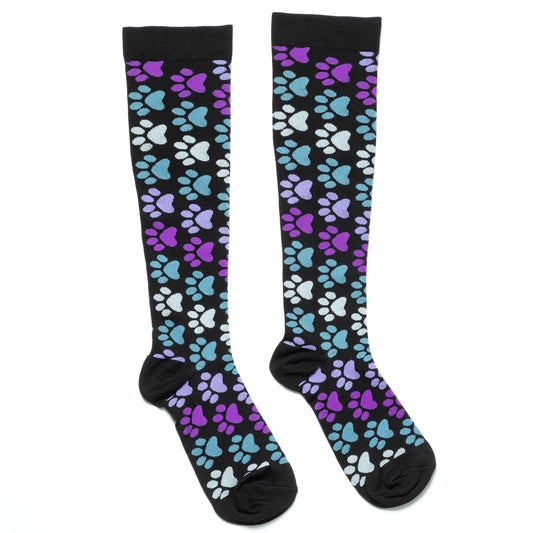 Compression socks with purple, blue, and white paw prints with a white background.