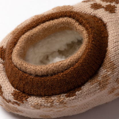 Close-up of a brown and beige knitted slipper sock, showing plush interior on a white background, brown paw sprig