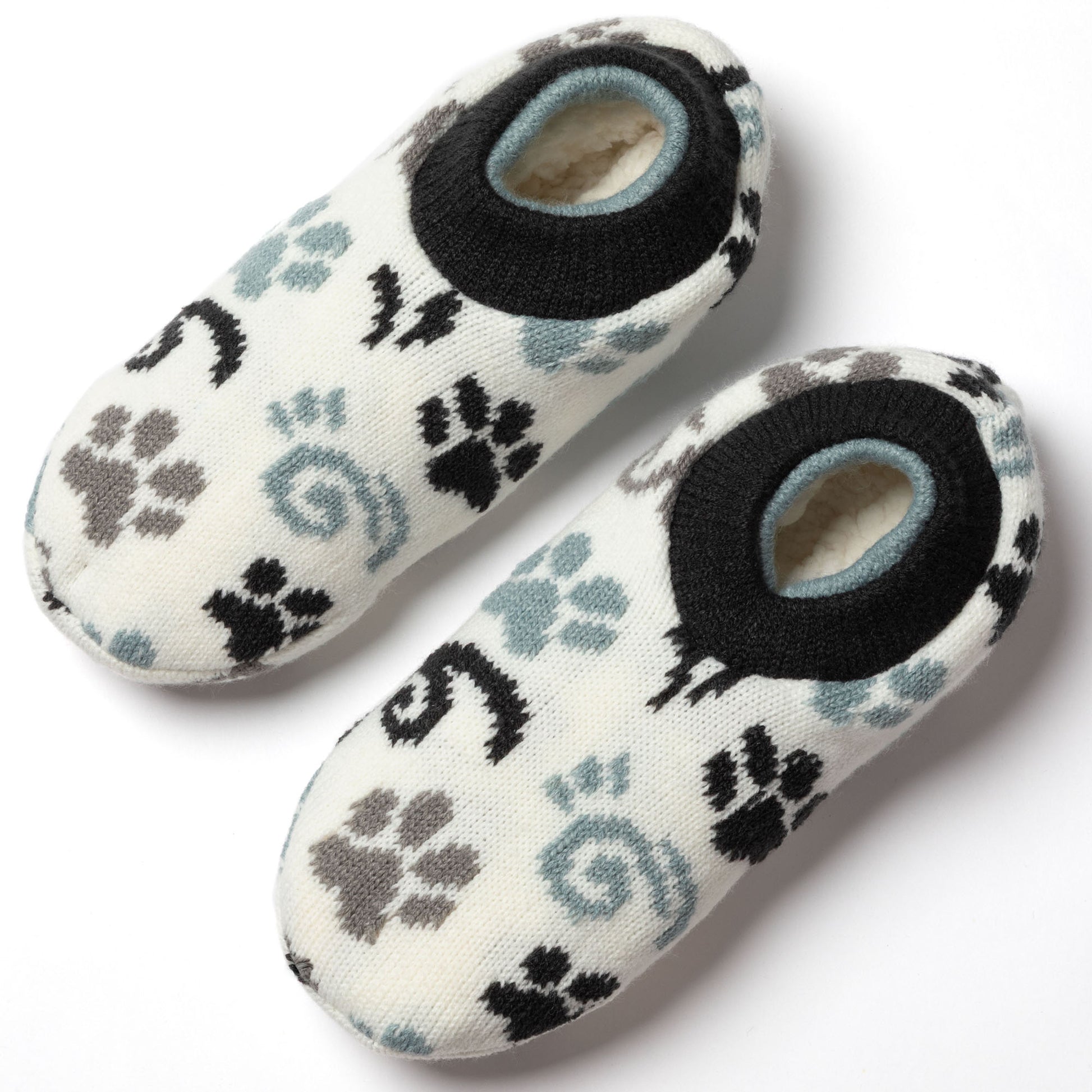 pair of white, blue, gray paw patterned knitted slipper socks, white background, showing plush interior blue gray paws swirls