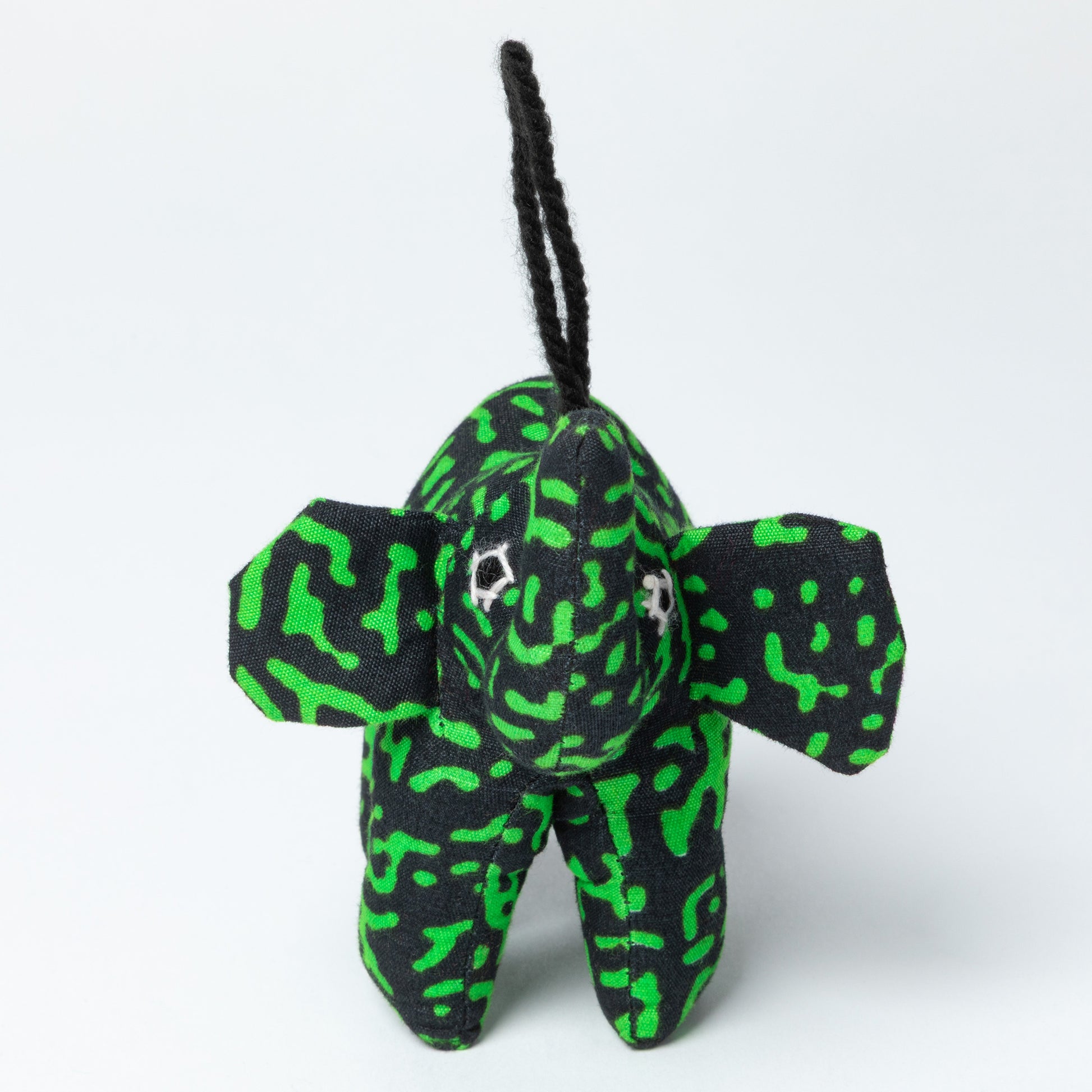 Plush elephant ornament with green and black pattern on a white background