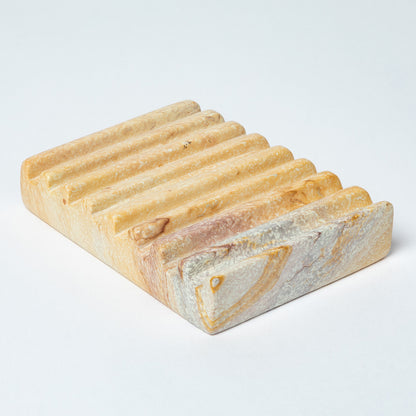 Rectangular soapstone soap dish with ridges and a natural marbled pattern on a white background.