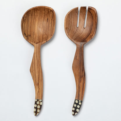 Wooden spoon and fork salad server set with decorative handles on a white background
