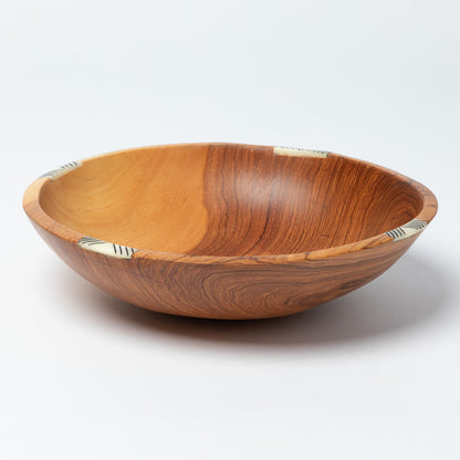 Wooden bowl with a natural finish on a white background