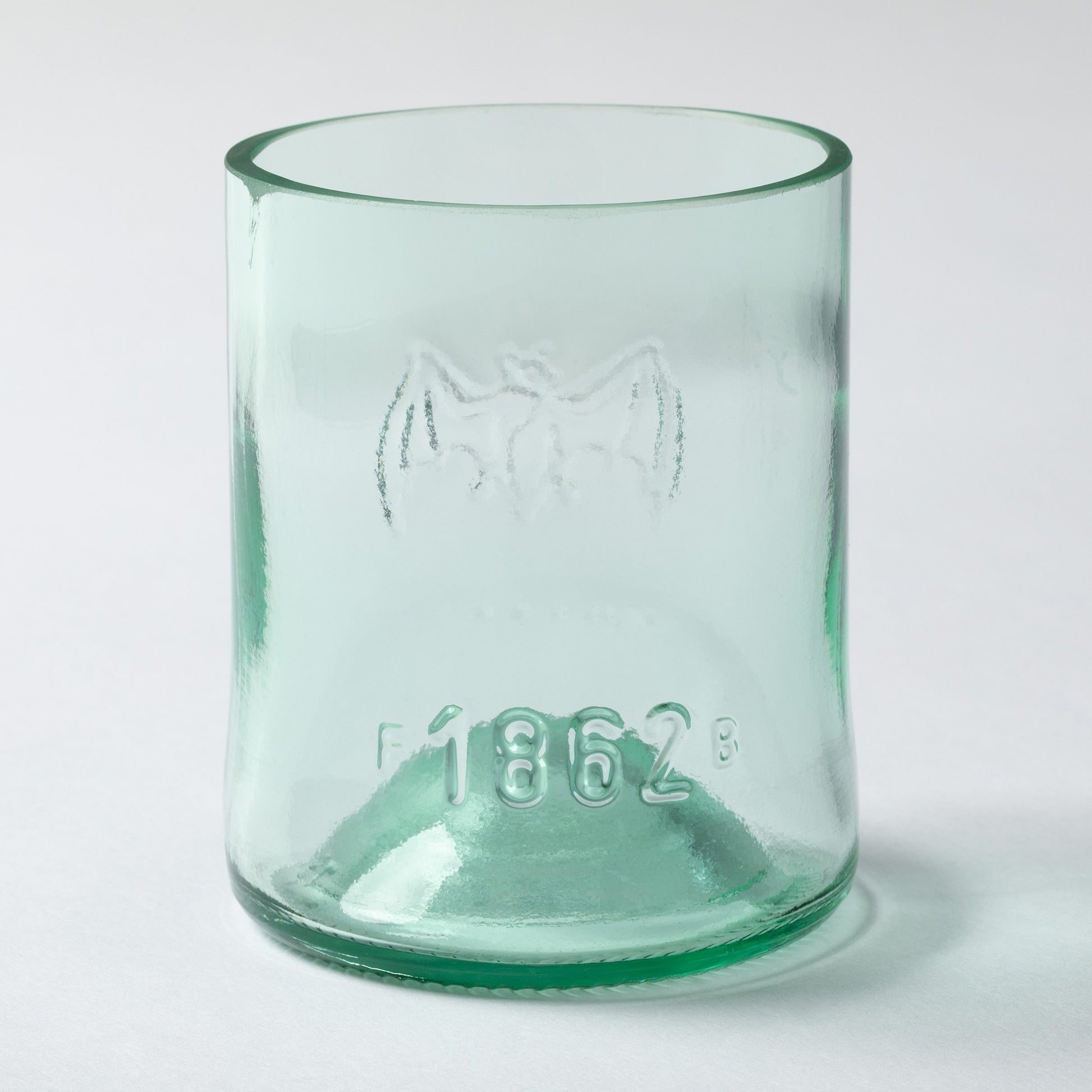 Clear recycled glass tumbler with on a white background