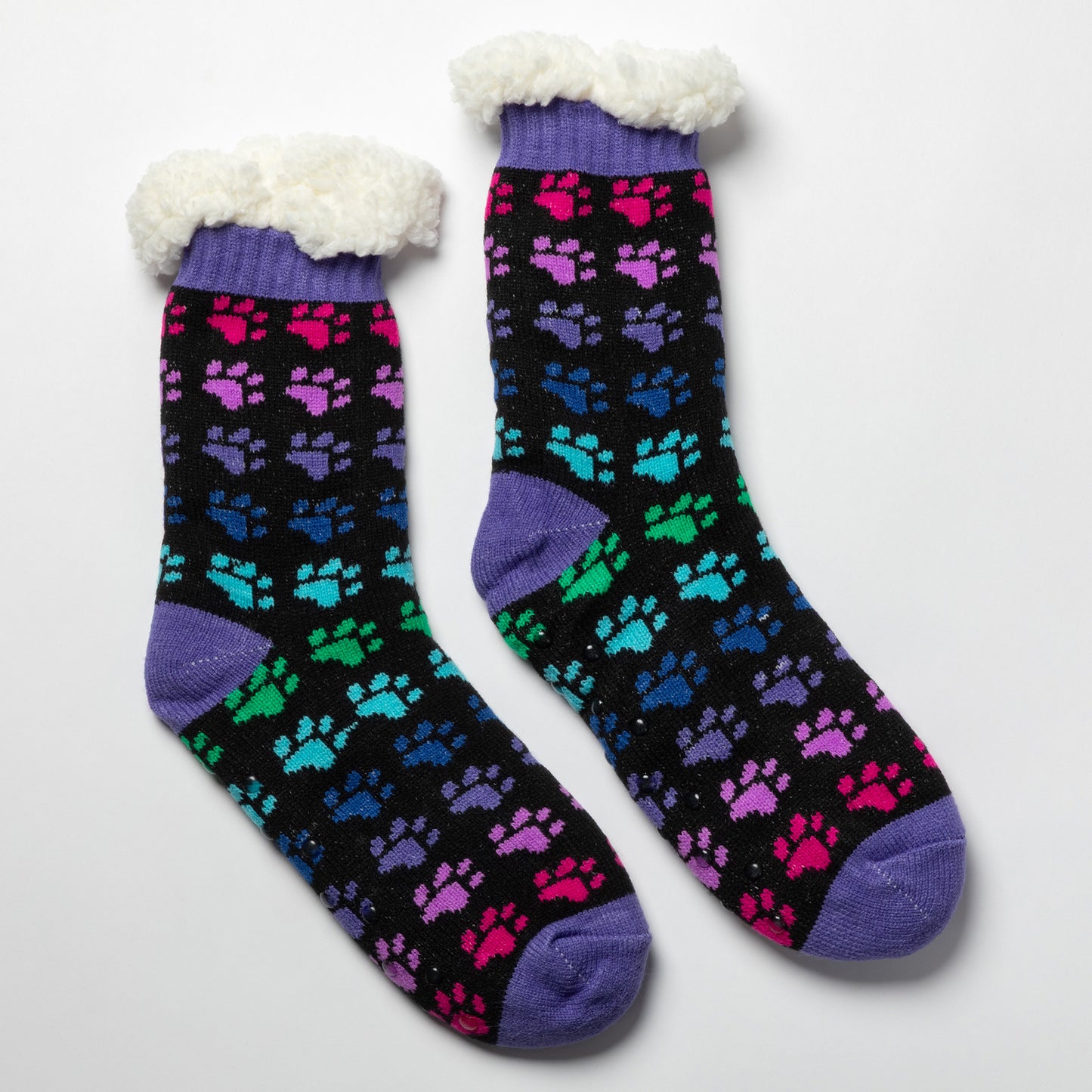 Pair of rainbow paws Sherpa Fleece Lined Paw Print Cabin Slipper Socks with sherpa trim on a light gray background rainbow paws