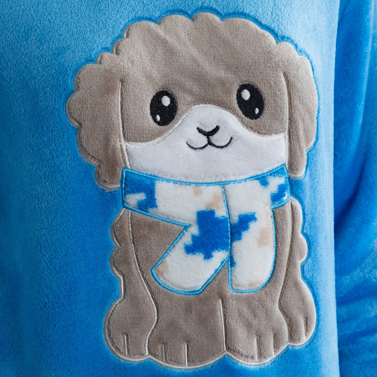 A blue long-sleeve top with an embroidered cute dog design Design a grey dog in super cozy fabric