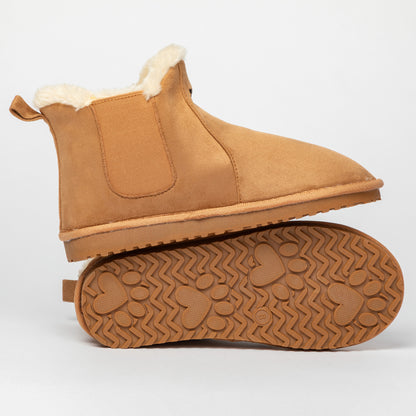 Tan ankle boot with white fur lining on a light gray background