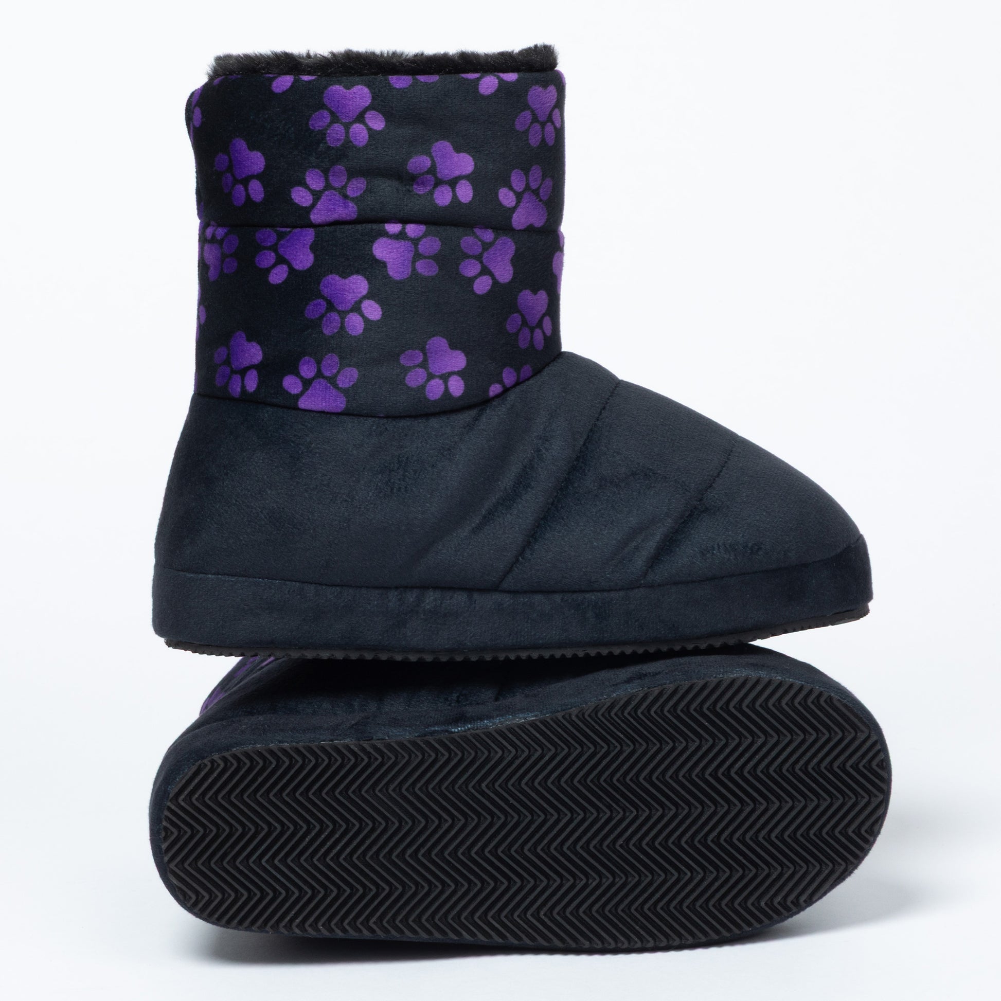 A pair of black slipper boots with a purple paw print pattern on the cuff, shown from the side and bottom against a white background.