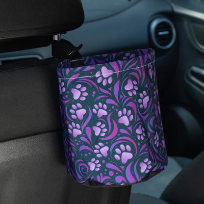 Car trash can with purple floral pattern attached to a car's interior.