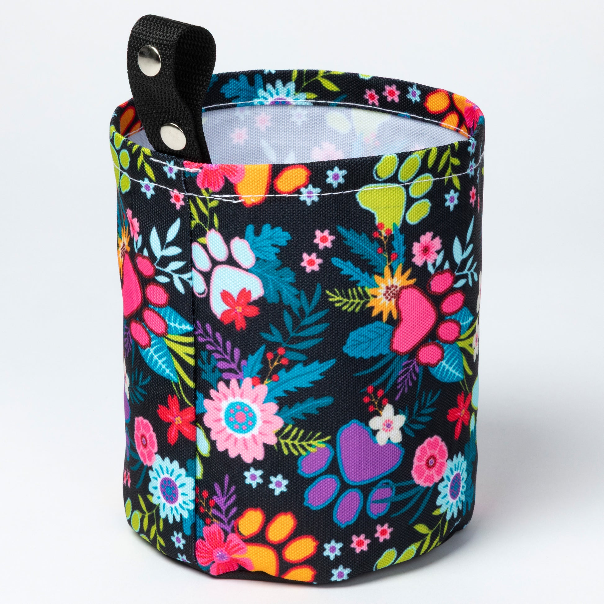 Floral-patterned bag with a black background on a white background