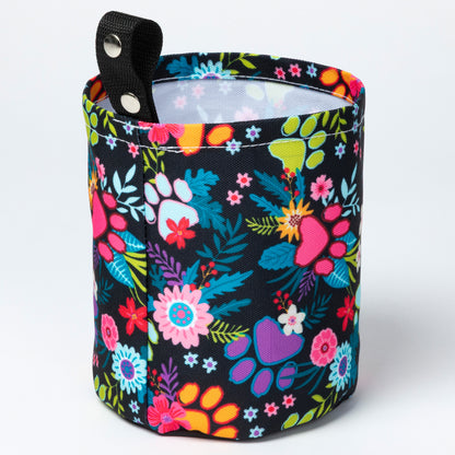 Floral-patterned bag with a black background on a white background