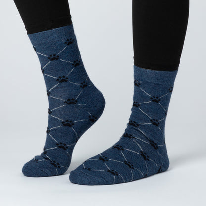 Blue socks with black paw prints on a white background