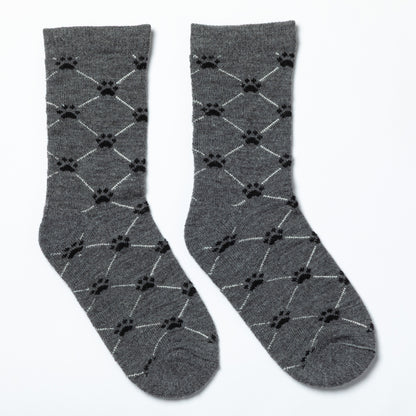 Gray socks with black paw print pattern on a white background