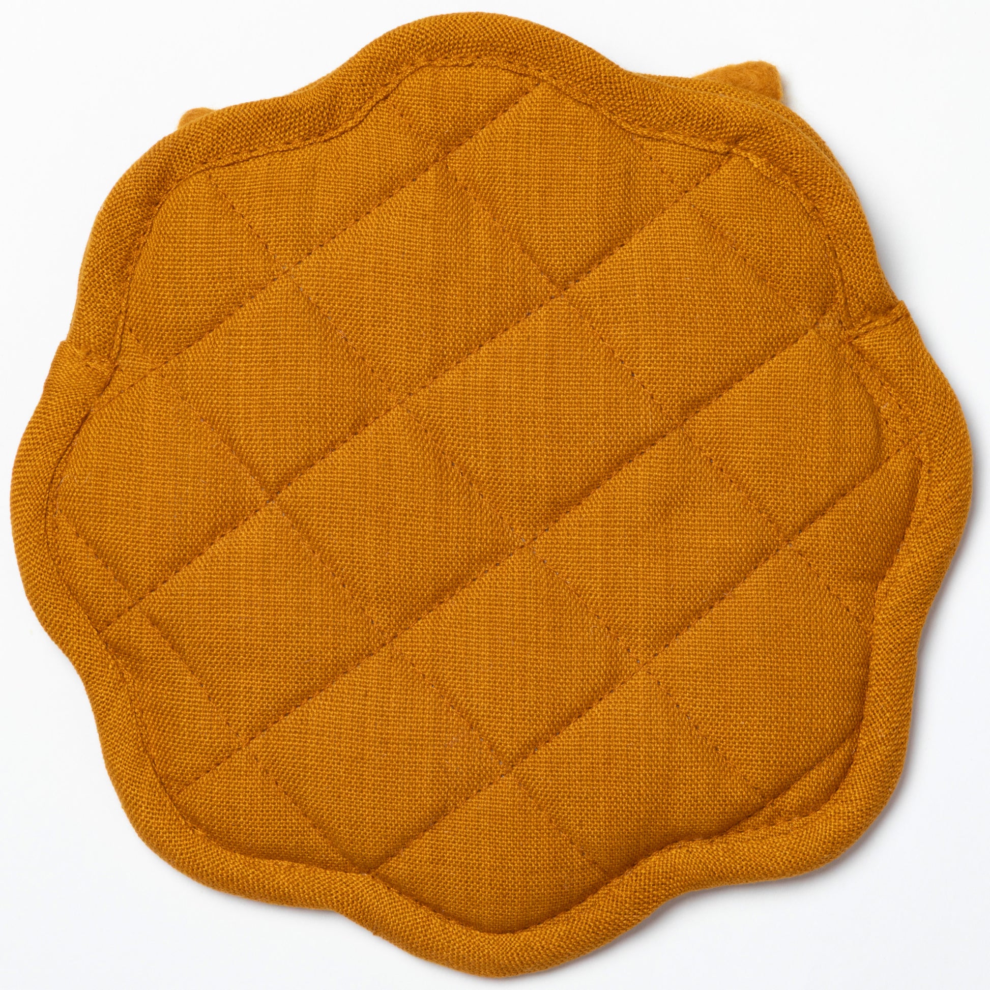 Yellow quilted tortilla holder on a white background