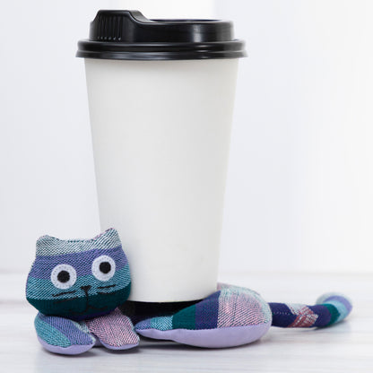 Plush cat shaped coaster with a coffee cup on a white background
