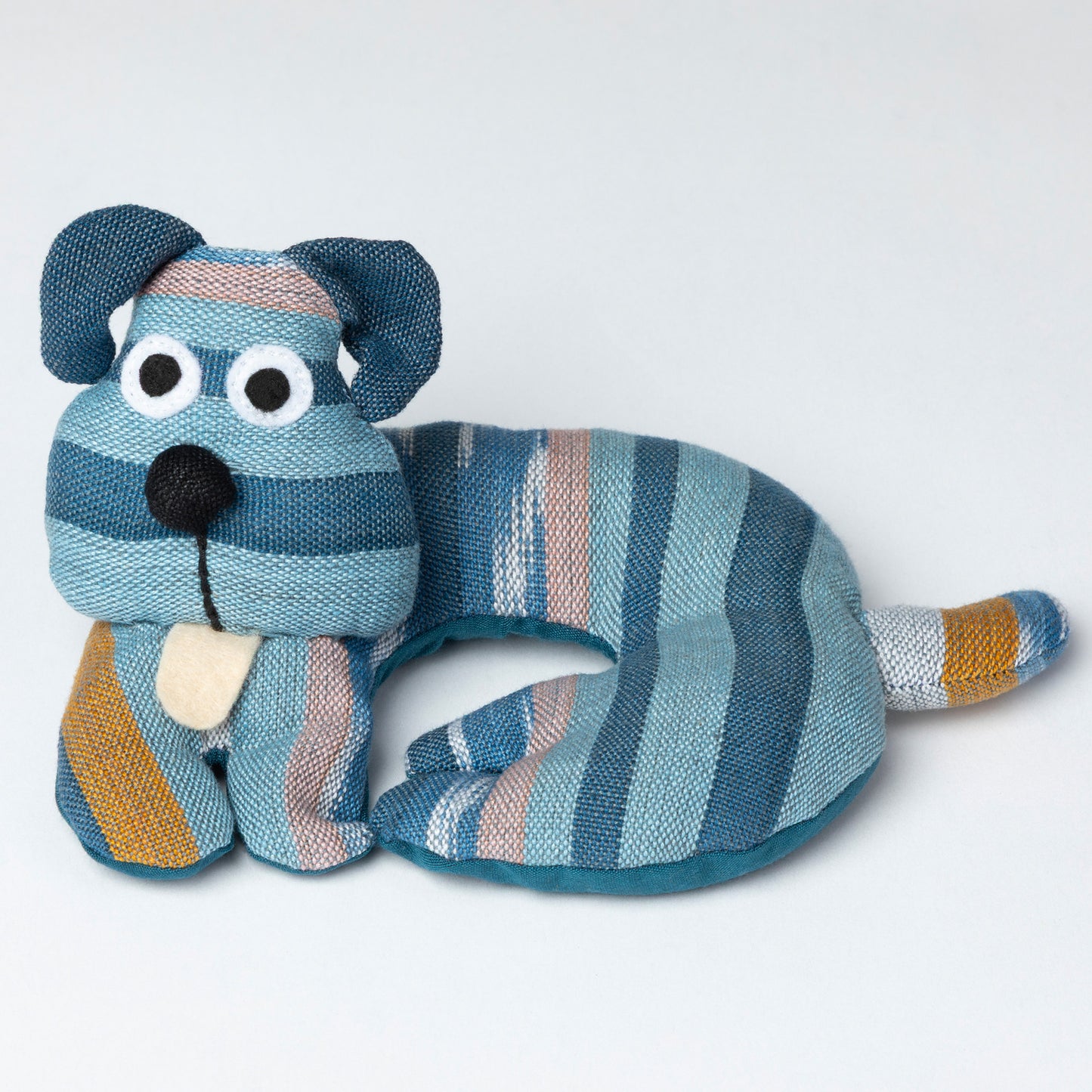 Striped dog-shaped coaster on a white background