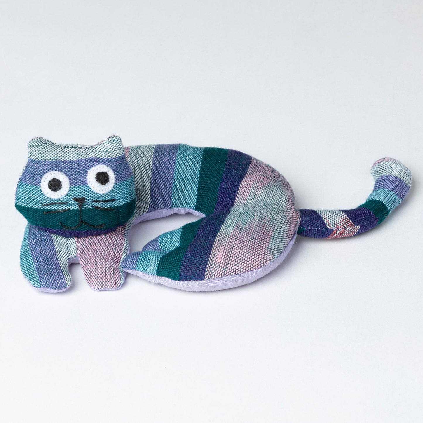 Striped cat-shaped coaster on a white background