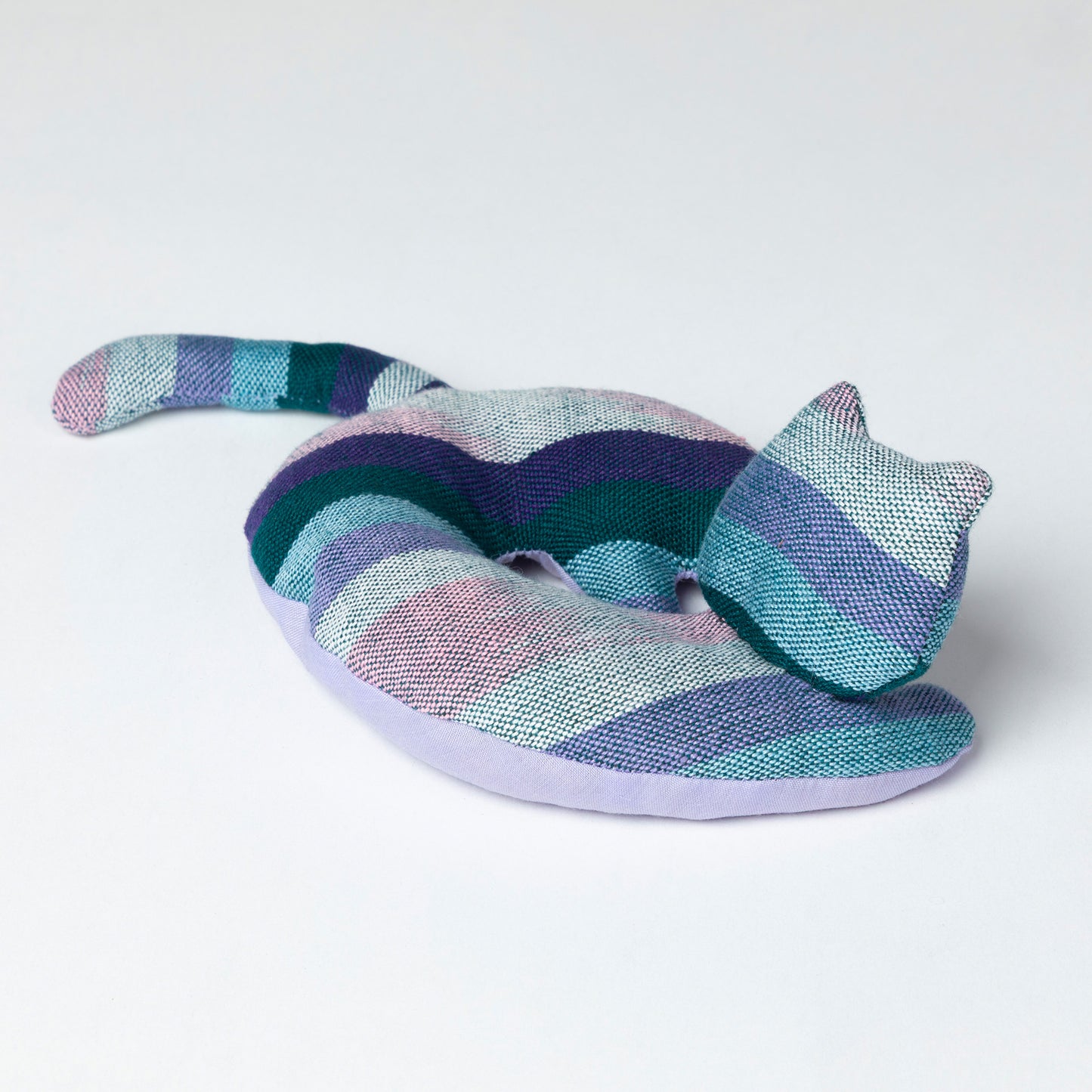 Colorful striped cat-shaped coaster on a white background