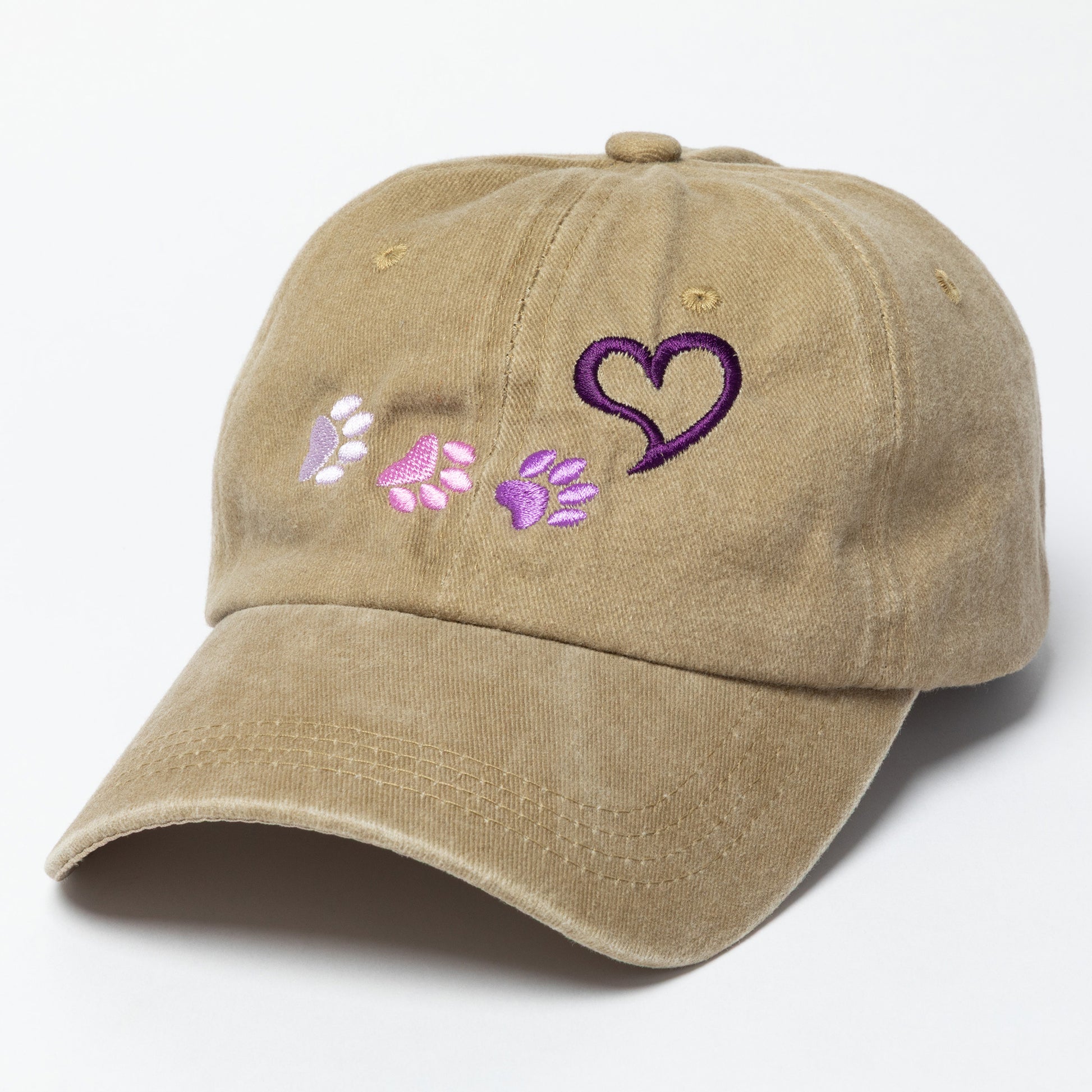 Tan cap with heart and paw print designs on a white background
