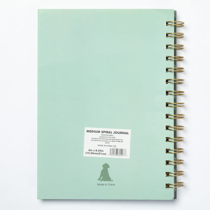 Mint green spiral journal on a white background