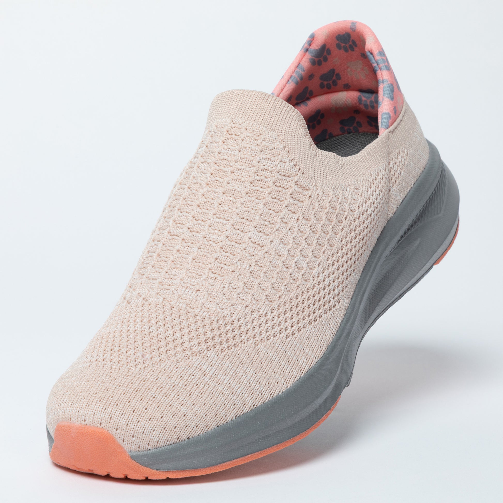 Light pink slip-on shoe with gray sole on a white background