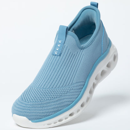 Blue slip-on sneaker with white sole on a light gray background