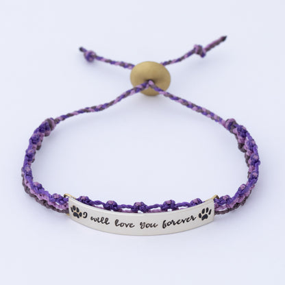 Purple braided bracelet with a silver tag reading 'I will love you forever' on a white background