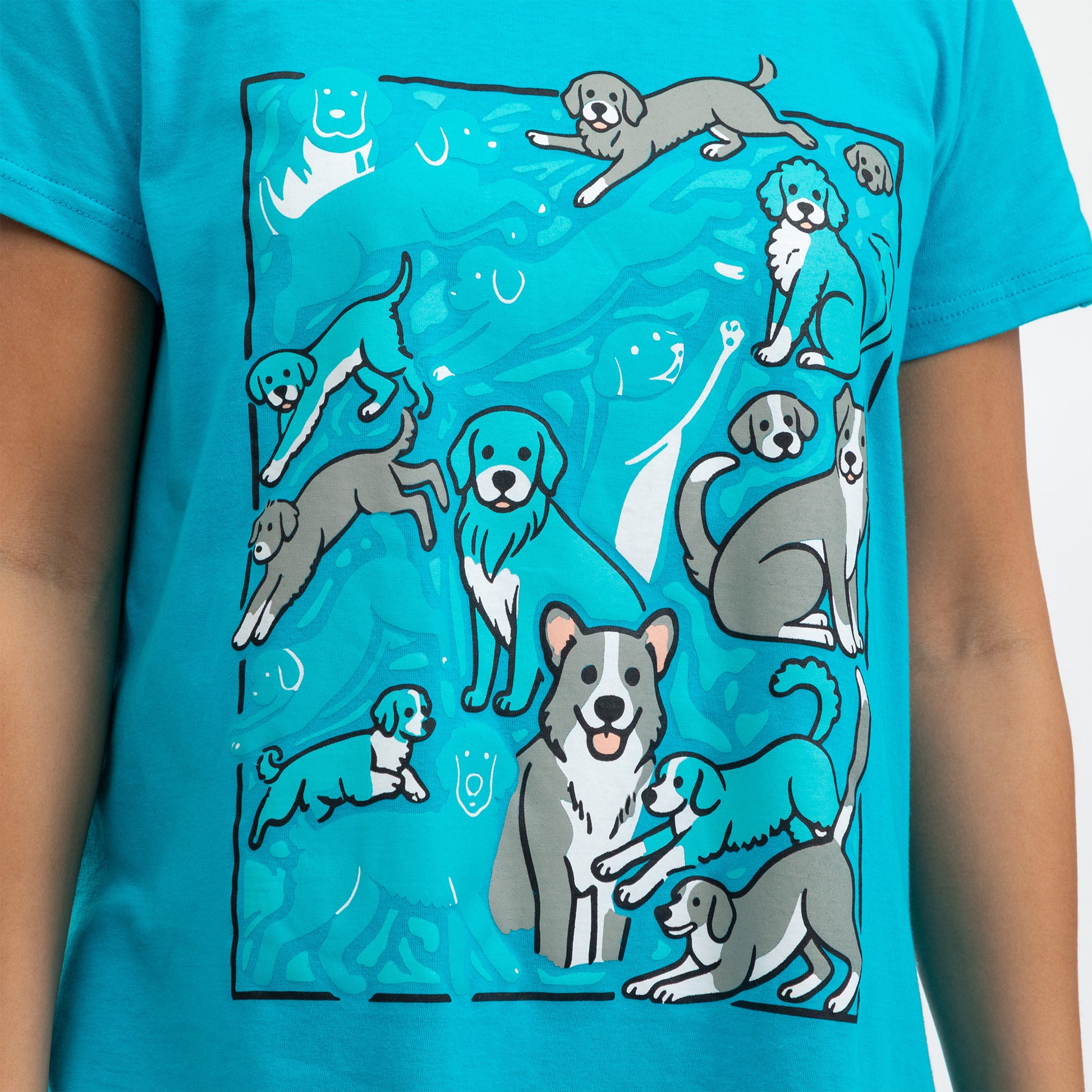 Graphic design nightgown featuring playful, illustrated dogs on a turquoise background.