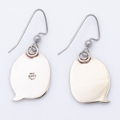 Silver earring backs shaped like speech bubbles on a light gray background.