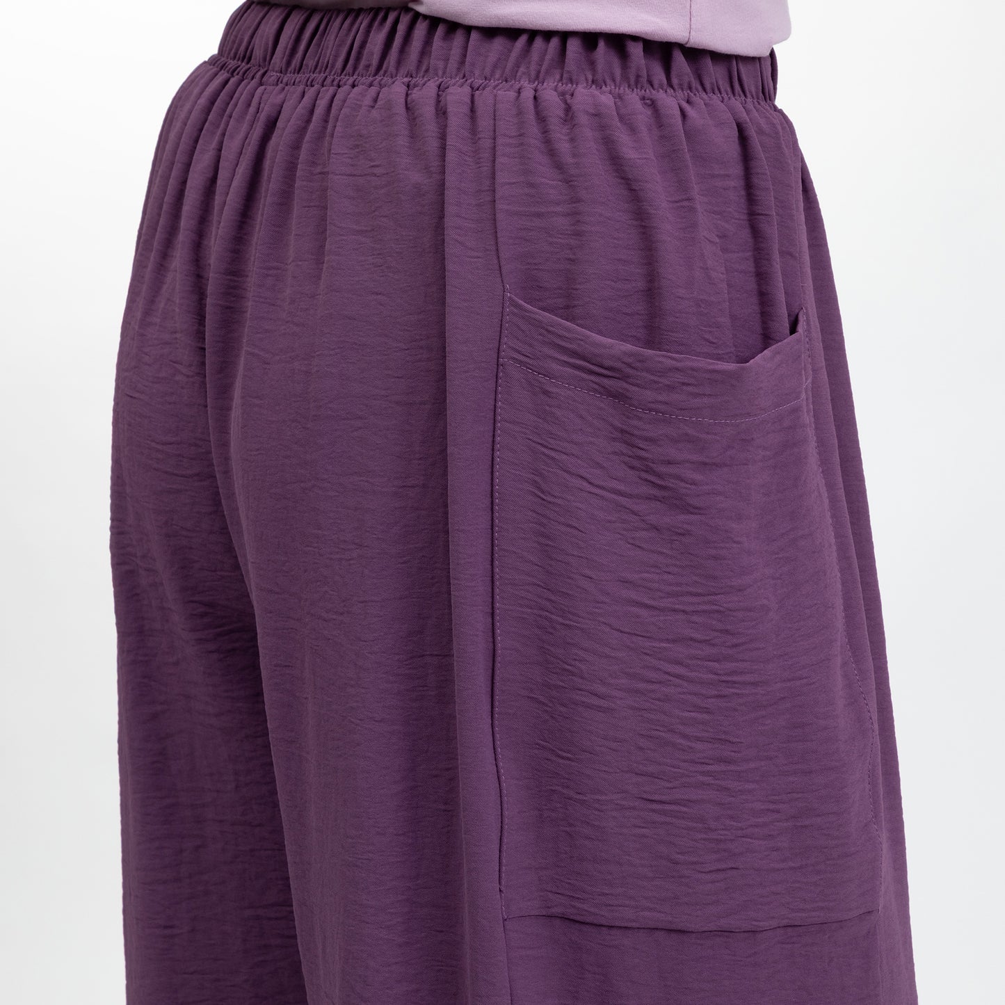 Purple pants with a pocket on a white background