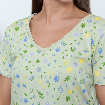 Light green top with floral pattern worn by a person