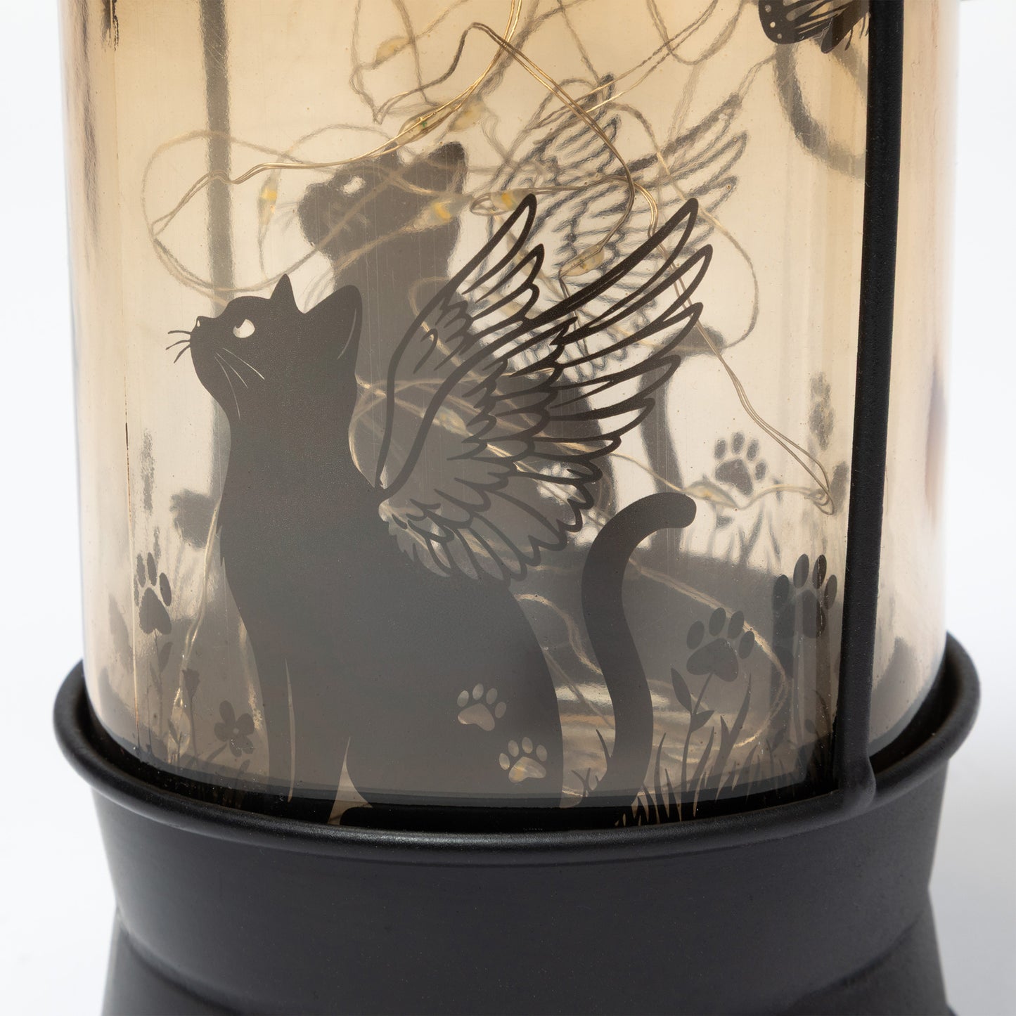 Decorative lantern with a black cat silhouette and wings design.