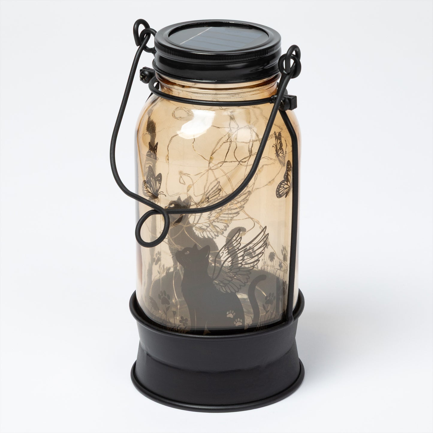 Solar lantern in a glass jar with decorative design on a white background
