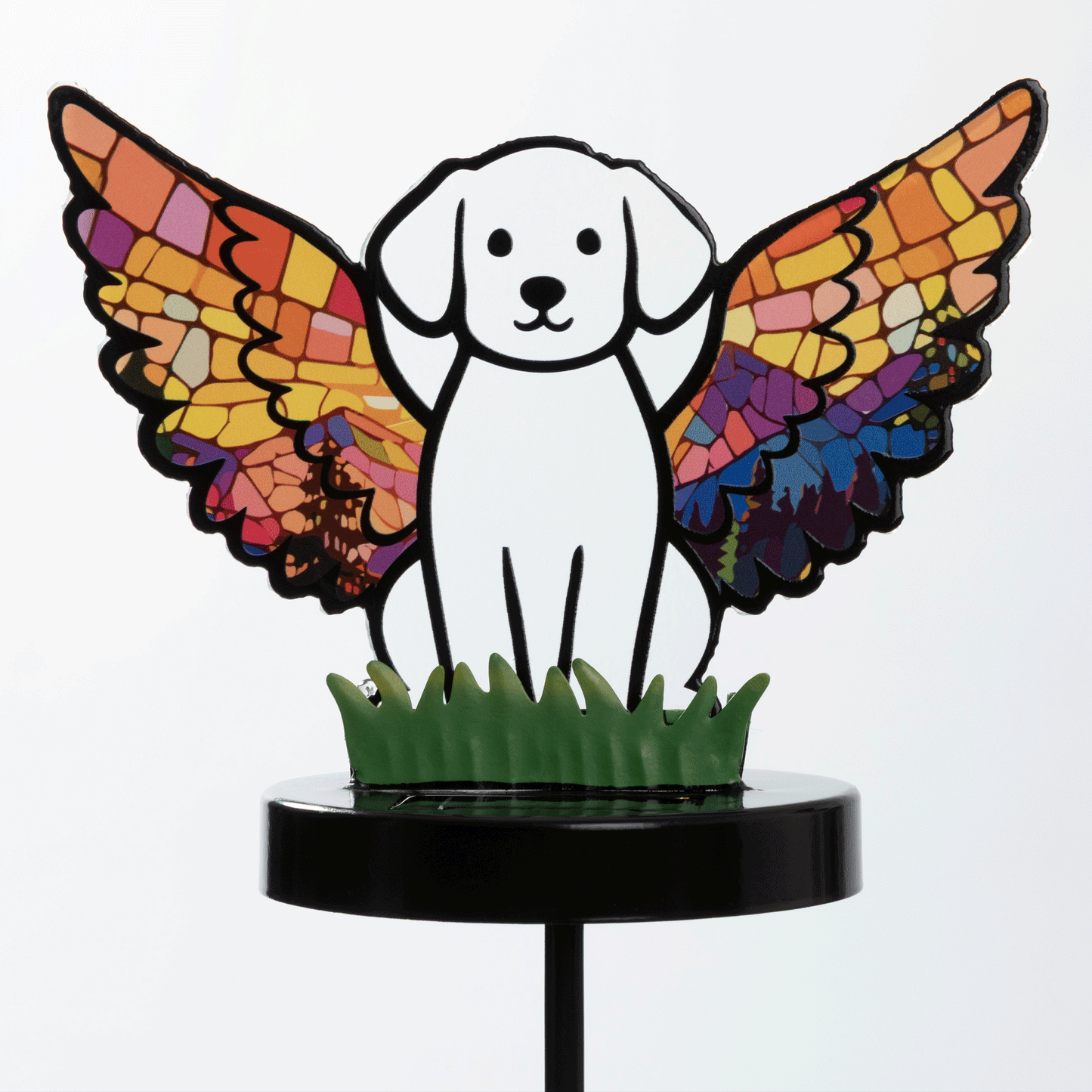 Glowing dog angel garden stake, shown on a white background, and in the dark with the light glowing.