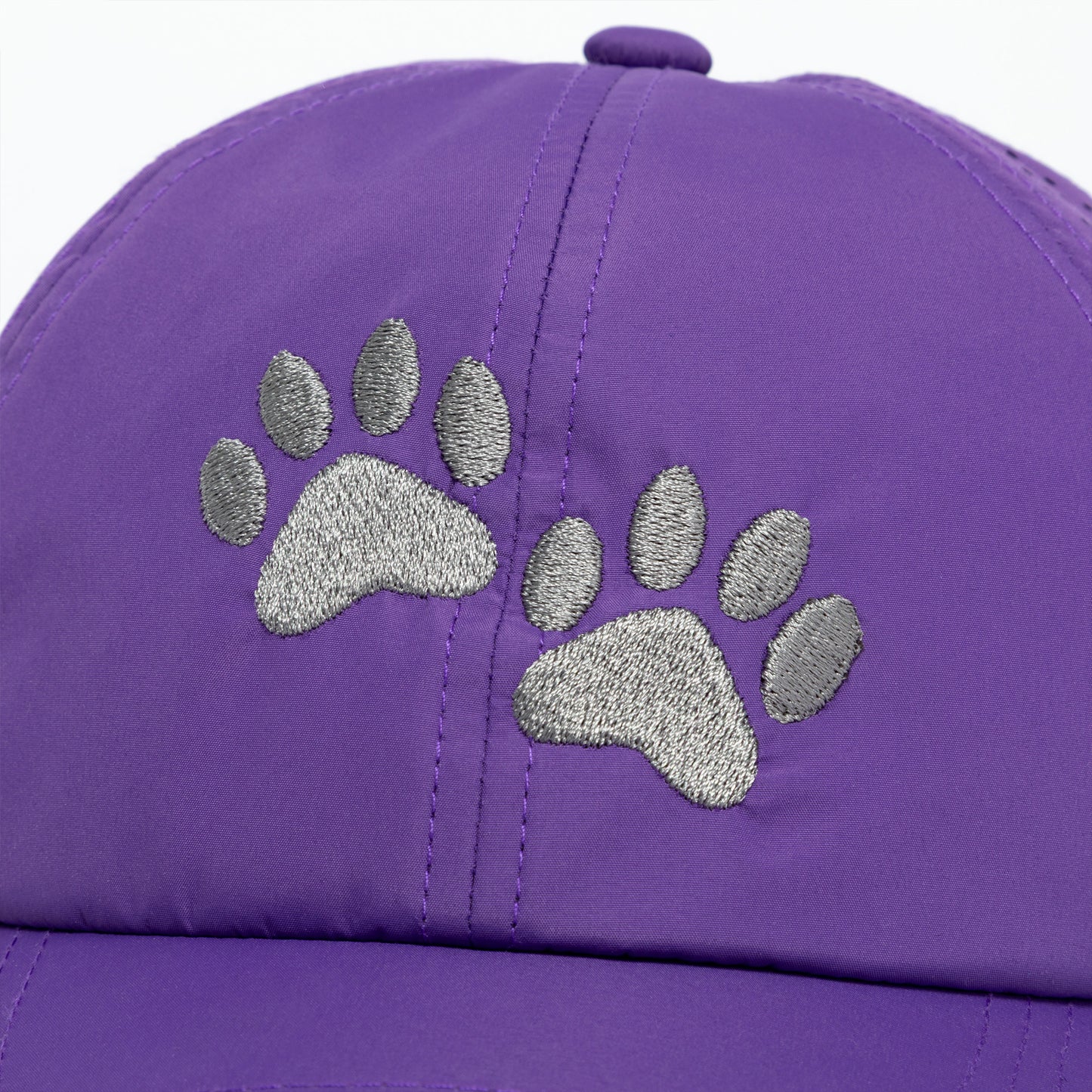 Purple cap with silver paw print design on a white background