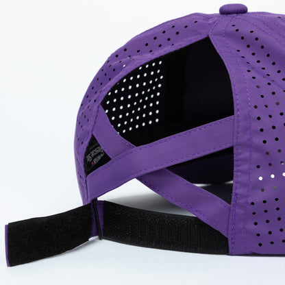 Purple cap with mesh back, adjustable strap, and ponytail opening on a white background