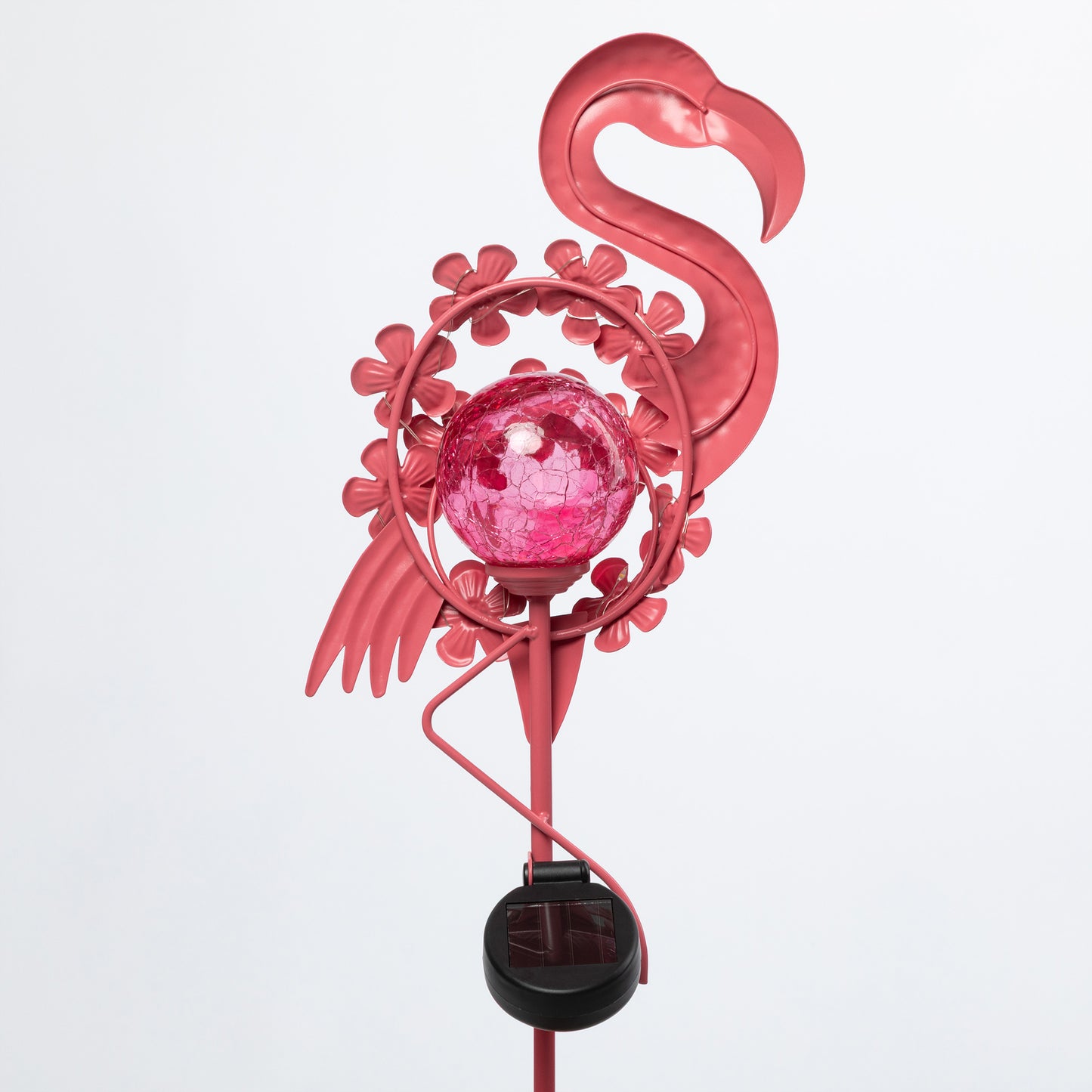 Pink flamingo-shaped garden light with a glass globe on a white background