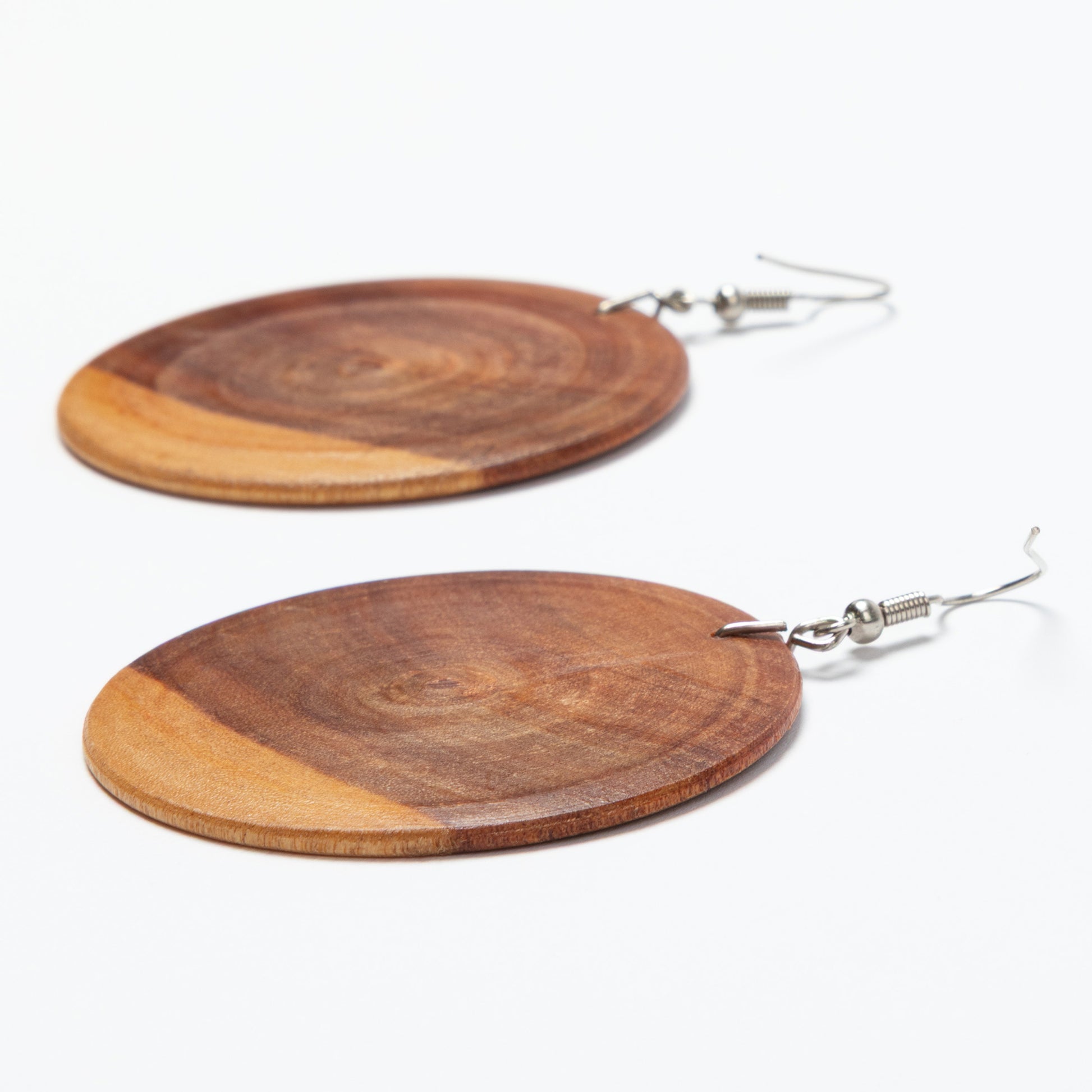 Wooden round earrings on a white background